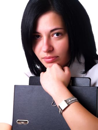 A portrait about a young pretty happy businesswoman with black hair who is holding some folders and she is wearing a white shirtの写真素材