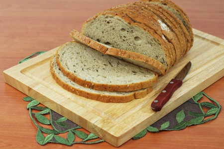 A loaf of sliced bread on a boardの写真素材