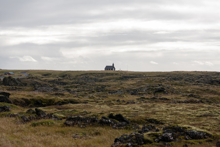 Many of Iceland's churches are dotted around the island in remote spaces. Some are even at the foot of volcanoes.の写真素材