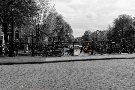 Black and white image of a canal in Amsterdamの写真素材