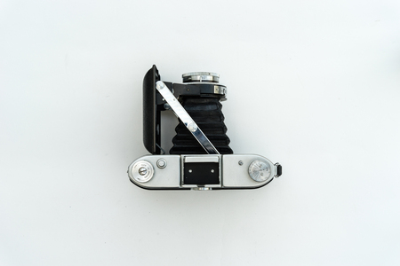 Analog camera seen from the top on a white backgroundの写真素材