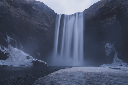 SkÃ³gafoss is one of Iceland's biggest and most beautiful waterfalls with an astounding width of 25 meters and a drop of 60 meters from a steep cliff, South coast, Icelandの写真素材