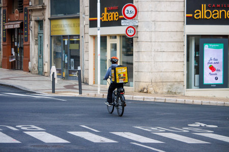 Perigueux, Dordogne, France June 03 2023: Pedaling Parcels: Bike Deliveryのeditorial素材