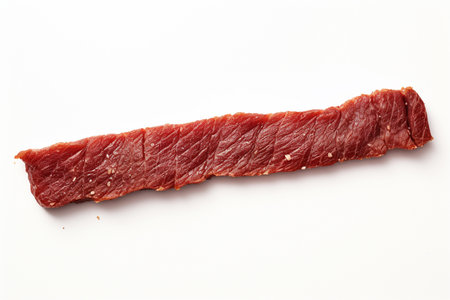 An Minimalist Food: Single Strip of Dried Beef on White Backgroundの素材
