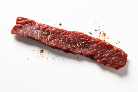 An Minimalist Food: Single Strip of Dried Beef on White Backgroundの素材