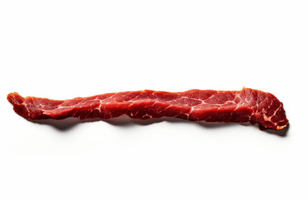 An Minimalist Food: Single Strip of Dried Beef on White Backgroundの素材