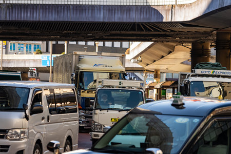 Tokyo, Japan, October 26, 2023: Congested Traffic Under Elevated Highway
