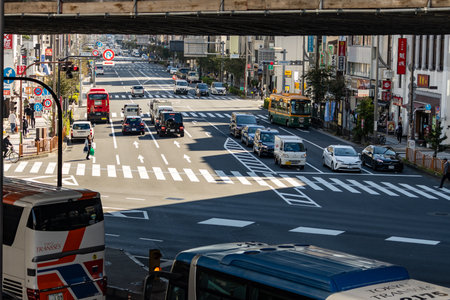Tokyo, Japan, October 26, 2023: Diverse Traffic and Pedestrian Activity at City Intersection