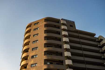 Tokyo, Japan, October 28, 2023: Modern Apartment Building at Duskのeditorial素材