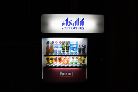Tokyo, Japan, October 28, 2023: Beverage Vending Machine Under Asahi Signageのeditorial素材