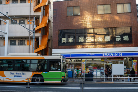Tokyo, Japan, October 28, 2023: City Bus in Front of a Lawson Convenience Storeのeditorial素材