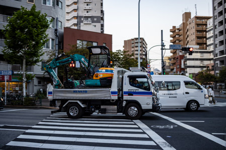 Tokyo, Japan, October 28, 2023: Construction Truck with Crane on Tokyo Streetのeditorial素材