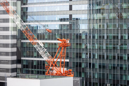 Tokyo, Japan, October 29, 2023: Tower crane on a modern building construction siteのeditorial素材