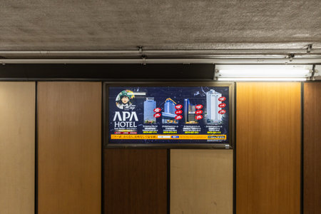 Tokyo, Japan, October 29, 2023: Hotel advertisement in subway corridorのeditorial素材