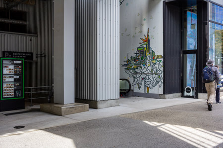 Tokyo, Japan, October 29, 2023: Modern building entrance with artistic mural in Tokyoのeditorial素材