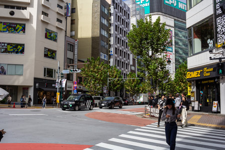 Tokyo, Japan, October 29, 2023: Urban crosswalk in Tokyo with pedestrians and trafficのeditorial素材