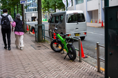 Tokyo, Japan, October 29, 2023: Pedestrians walking on a city sidewalkのeditorial素材