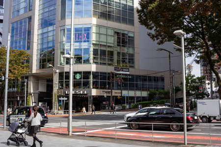 Tokyo, Japan, October 29, 2023: Urban corner with modern architecture and pedestrian crossingのeditorial素材