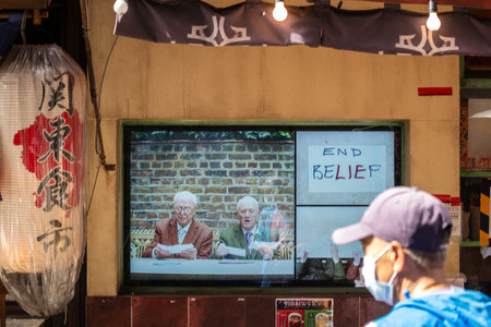 Tokyo, Japan, October 29, 2023: Outdoor TV Screen Displaying News in Asakusaのeditorial素材