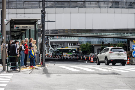 Tokyo, Japan, October 29, 2023: Pedestrians waiting at crosswalk in busy cityのeditorial素材
