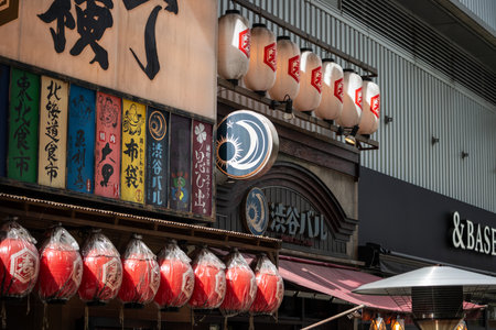 Tokyo, Japan, October 29, 2023: Izakaya Entrance with Colorful Lanterns and Signsのeditorial素材