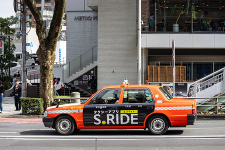 Tokyo, Japan, October 29, 2023: Taxi with S.RIDE Advertisement in Urban Tokyoのeditorial素材