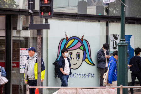 Tokyo, Japan, October 29, 2023: uCross-FM Advertisement on Tokyo Streetのeditorial素材