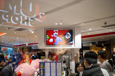 Tokyo, Japan, October 29, 2023: Customers at Nintendo Tokyo Store with Screen Display