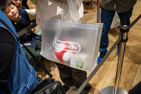 Tokyo, Japan, October 29, 2023: Customer holding a Nintendo shopping bag inside a storeのeditorial素材