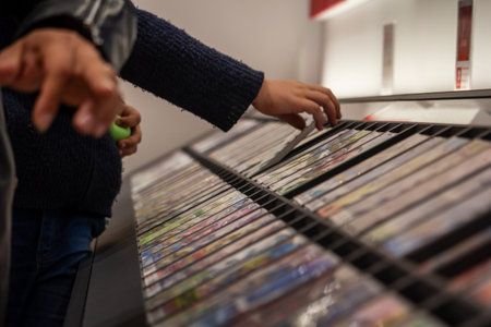 Tokyo, Japan, October 29, 2023: Customer browsing through a selection of video gamesのeditorial素材