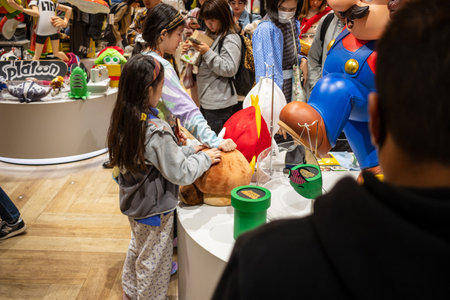 Tokyo, Japan, October 29, 2023: Young child looking at Nintendo toys in a storeのeditorial素材