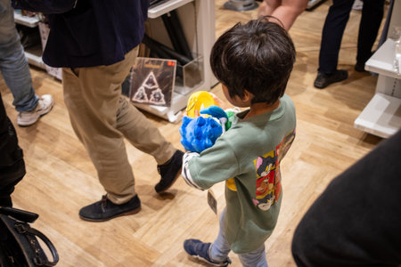 Tokyo, Japan, October 29, 2023: Child with a Nintendo plush toy in a storeのeditorial素材