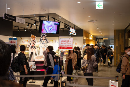 Tokyo, Japan, October 29, 2023: Customers viewing anime figures at a gaming convention