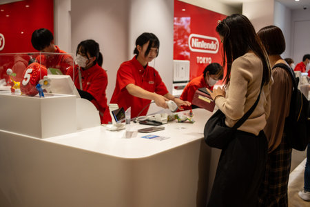 Tokyo, Japan, October 29, 2023: Employees serving customers at a Nintendo storeのeditorial素材