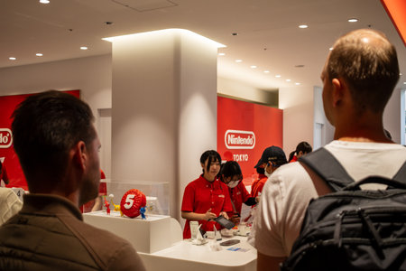 Tokyo, Japan, October 29, 2023: Shoppers queuing at a Nintendo store checkout counterのeditorial素材