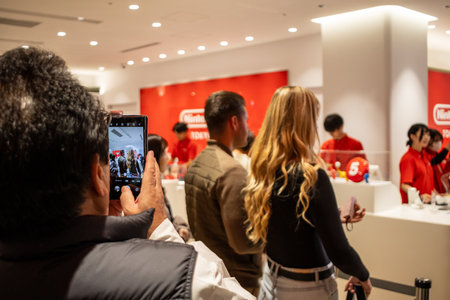 Tokyo, Japan, October 29, 2023: Customers capturing their visit to a Nintendo store with smartphonesのeditorial素材