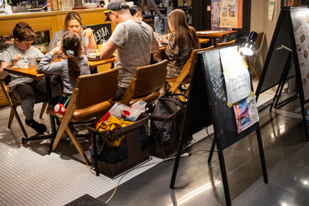 Tokyo, Japan, October 29, 2023: Customers dining at a restaurant in a shopping centerのeditorial素材