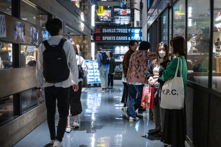 Tokyo, Japan, October 29, 2023: Collectors browsing sports cards at a specialty store