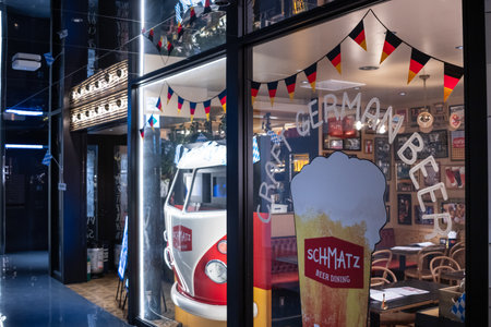 Tokyo, Japan, October 29, 2023: Exterior of a German beer pub with a vintage van insideのeditorial素材
