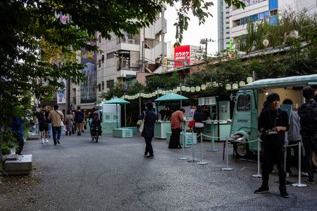 Tokyo, Japan, October 29, 2023: Outdoor market stalls and visitors in Tokyo