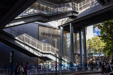 Tokyo, Japan, October 29, 2023: Modern architecture of a luxury brand store in a bustling districtのeditorial素材