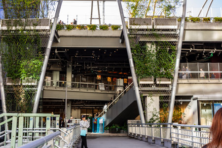 Tokyo, Japan, October 29, 2023: Eco-friendly urban architecture with green plants on building facadeのeditorial素材