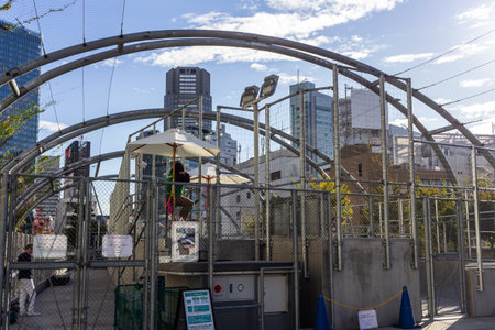 Tokyo, Japan, October 29, 2023: Modern pedestrian walkway with metal arches in urban Tokyoのeditorial素材