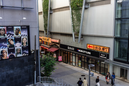 Tokyo, Japan, October 29, 2023: Street view featuring posters and traditional restaurants in an alleyのeditorial素材