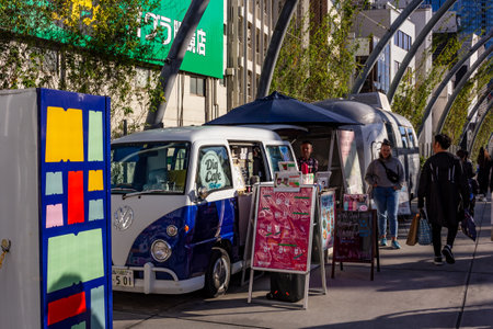 Tokyo, Japan, October 29, 2023: Vintage van converted into a mobile cafe on city streetのeditorial素材