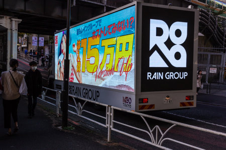 Tokyo, Japan, October 29, 2023: Advertising truck with bright billboards parked on a city streetのeditorial素材
