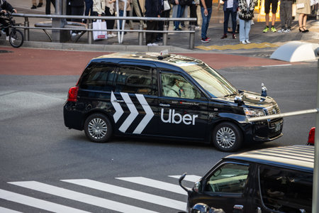 Tokyo, Japan, October 29, 2023: Uber vehicle in urban traffic