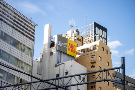 Tokyo, Japan, October 29, 2023: Urban landscape with a variety of commercial signage on building rooftopsのeditorial素材