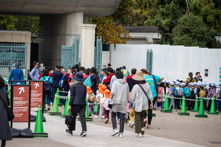 Tokyo, Japan, October 31, 2023: Crowd of Visitors Queuing at Ueno Zoo Entrance
