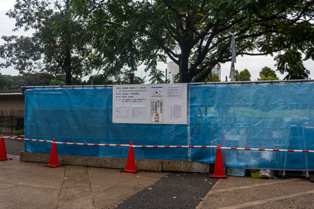 Tokyo, Japan, October 31, 2023: Construction Site with Informational Posters in Tokyo
